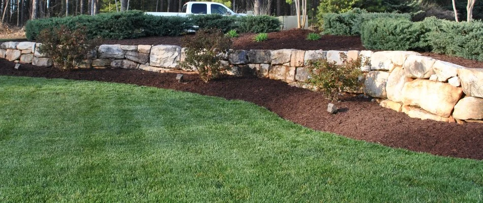 A boulder retaining wall for a landscape in Charlotte, NC.