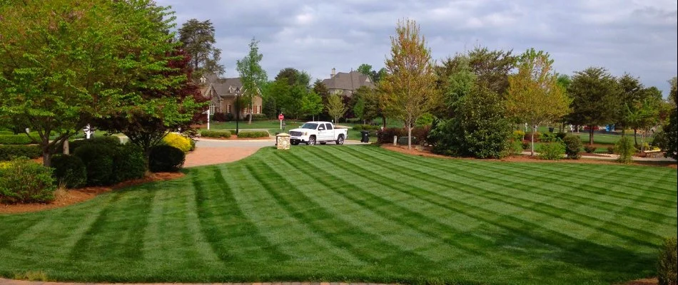 Concord, NC home with a freshly mowed lawn with stripes.