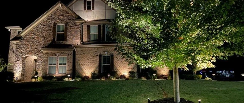 Home in Charlotte, NC, illuminated with lights.