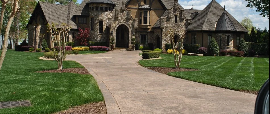 A house in Charlotte, NC, with a paver driveway.