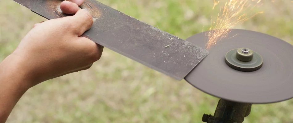 Mower blade being sharpened in Charlotte, NC.