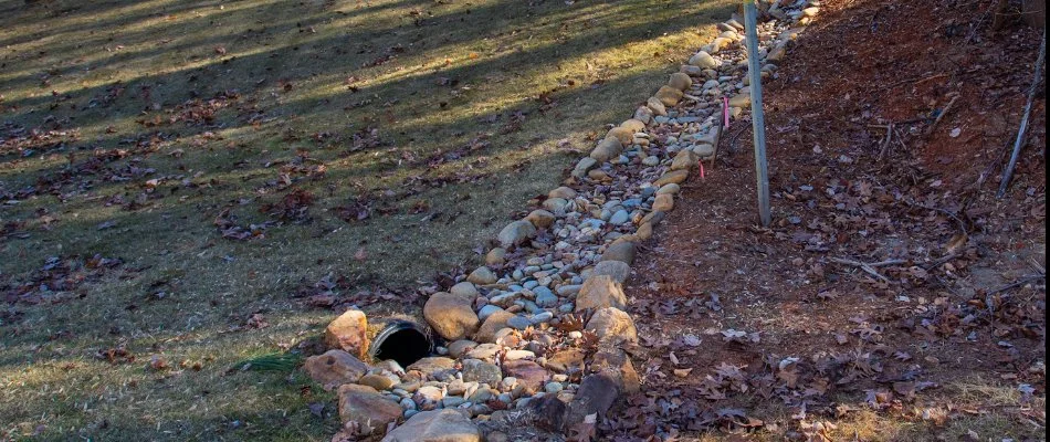 A dry creek bed in Lake Norman, NC, leading to a drain.
