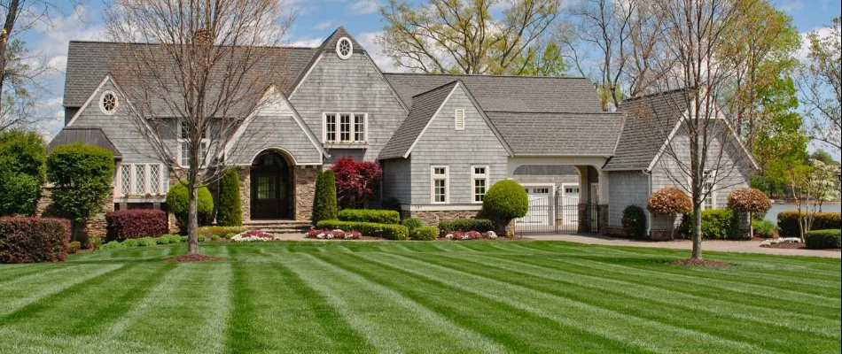 A property in Matthews, NC, with a beautiful green lawn.