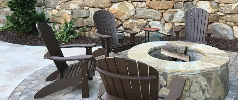 Fire pit on a patio in Davidson, NC, with chairs.