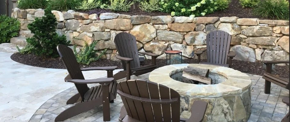 Round fire pit with chairs.